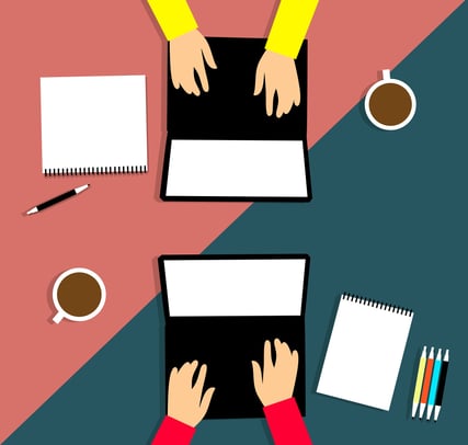 Illustration of two people on laptops from above with notepads and coffee cups by their computers