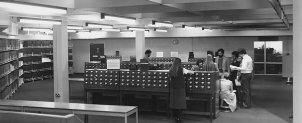 Researching - people in library conducting research